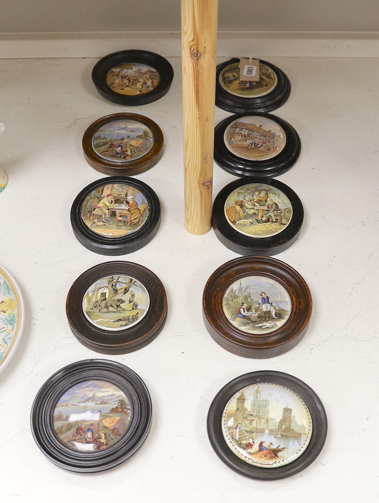 Ten 19th century framed ceramic pot lids